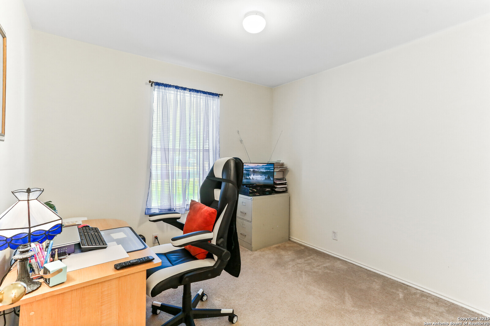 365 Leonardo Kyle, TX 78640 - Photo 13 of 17 a view of a workspace with furniture and a window