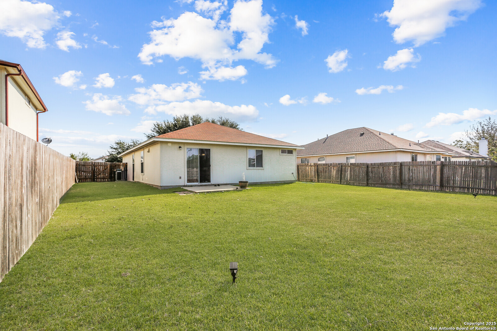 365 Leonardo Kyle, TX 78640 - Photo 14 of 17 a front view of house with yard and patio