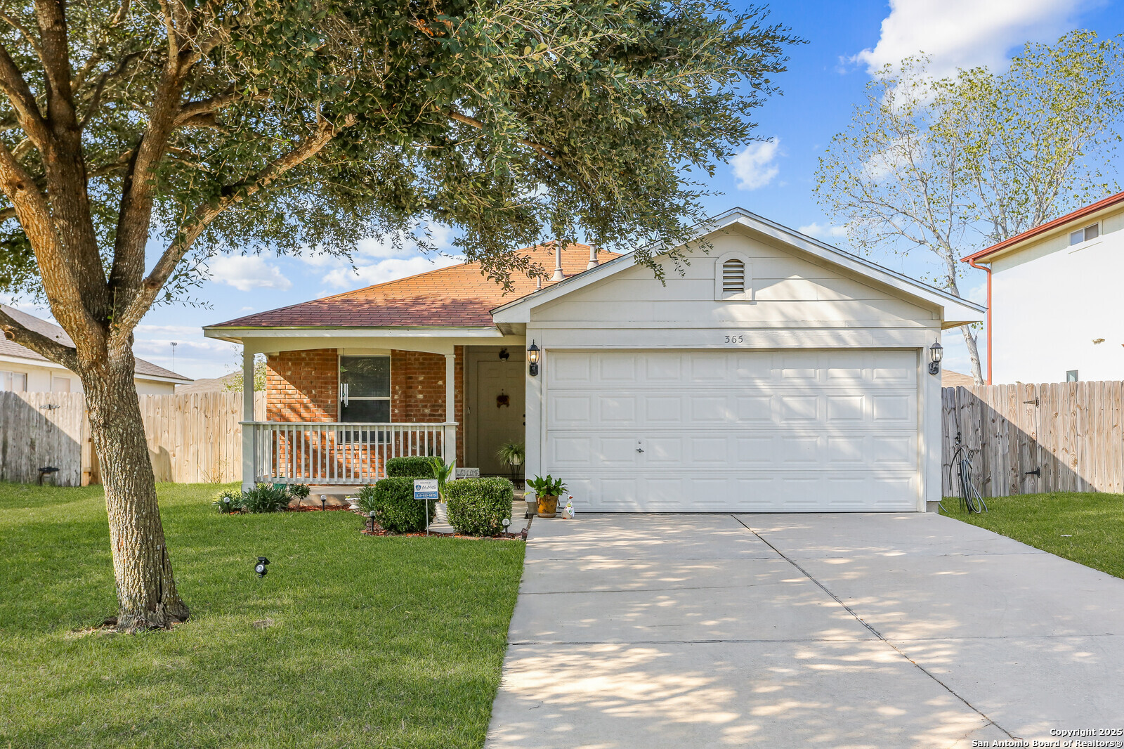 365 Leonardo Kyle, TX 78640 - Photo 2 of 17 a front view of a house with a yard and garage