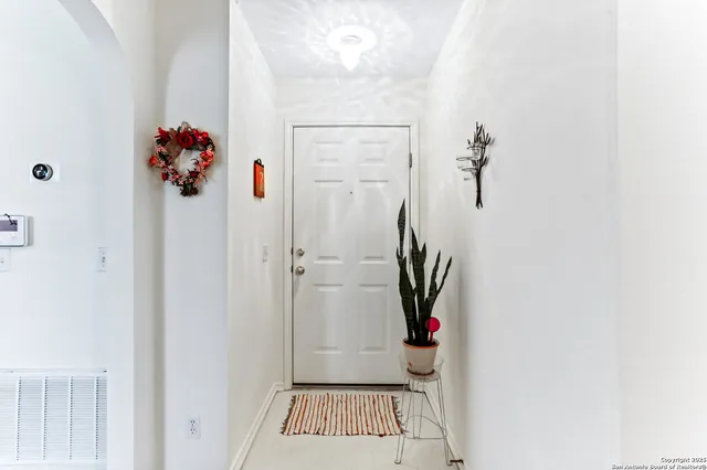a view of entryway with bathroom