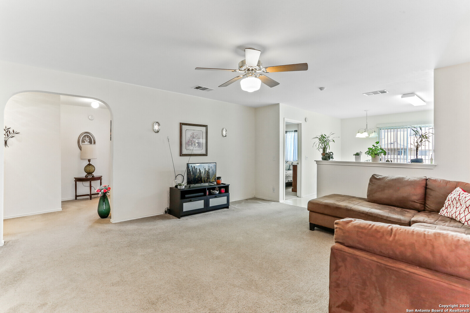 365 Leonardo Kyle, TX 78640 - Photo 6 of 17 a living room with furniture and a chandelier