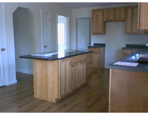 477 Oakham Road Barre, MA 01005 - Photo 2 of 3 a kitchen with cabinets and wooden floor
