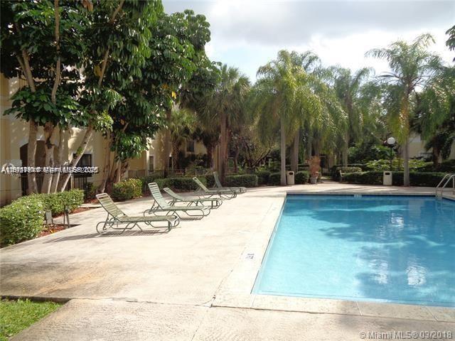 650 South Park Road, Unit 215 Hollywood, FL 33021 - Photo 21 of 24 a view of a swimming pool with an outdoor space