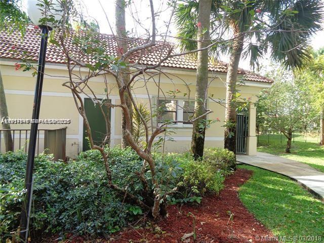 650 South Park Road, Unit 215 Hollywood, FL 33021 - Photo 22 of 24 a view of a building with a garden