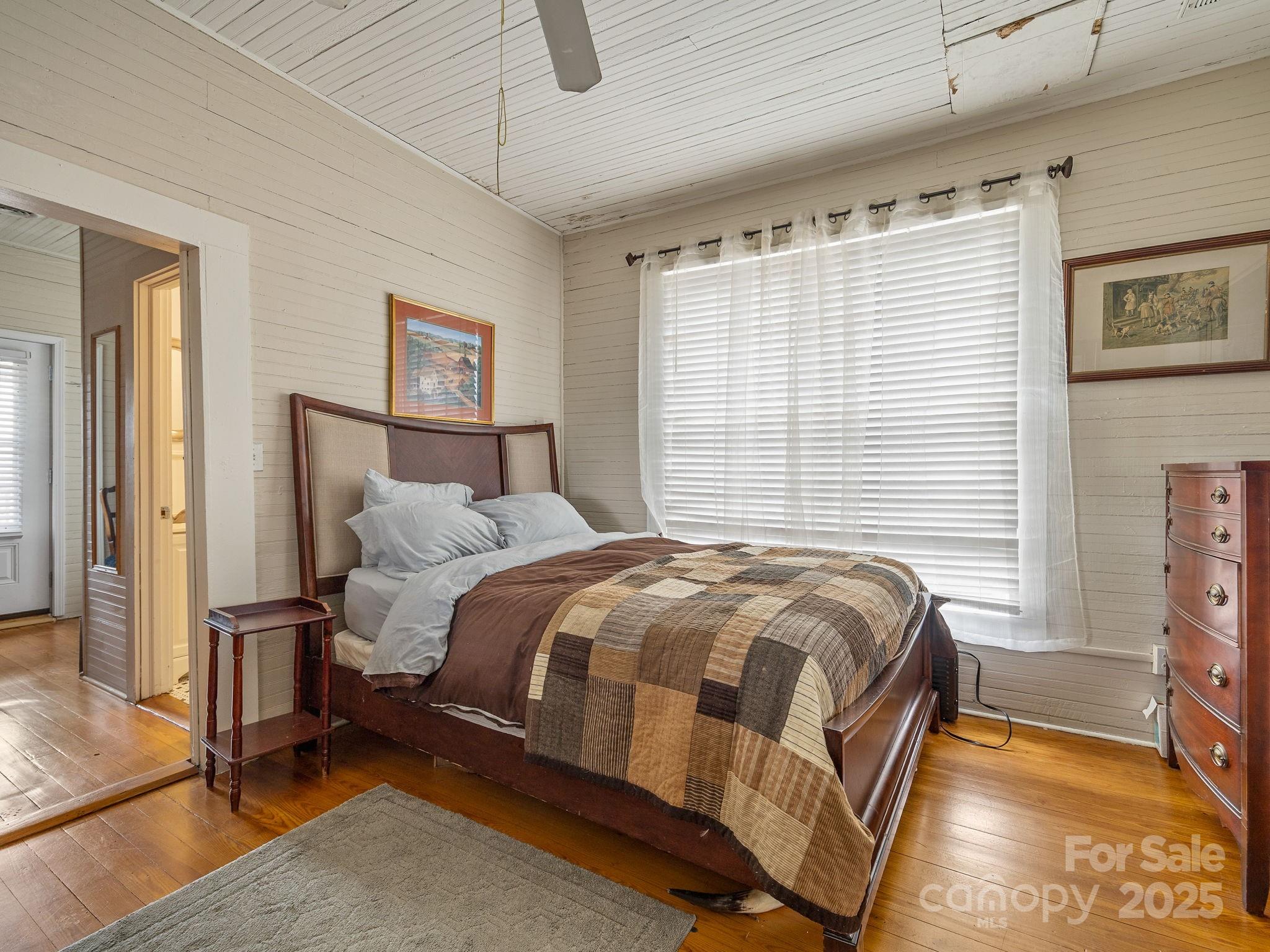 139 Clarkson Lane Tryon, NC 28782 - Photo 17 of 48 a bed sitting in a bedroom next to a window