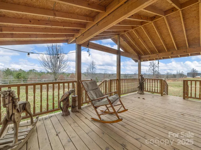 a view of roof deck with wooden floor and outer view