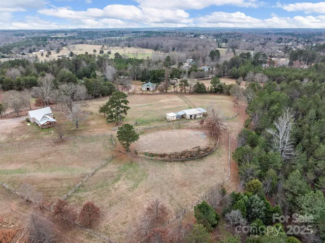 an aerial view of a houses with outdoor space