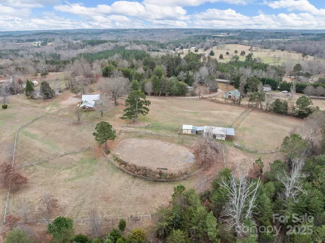 an aerial view of a house with outdoor space