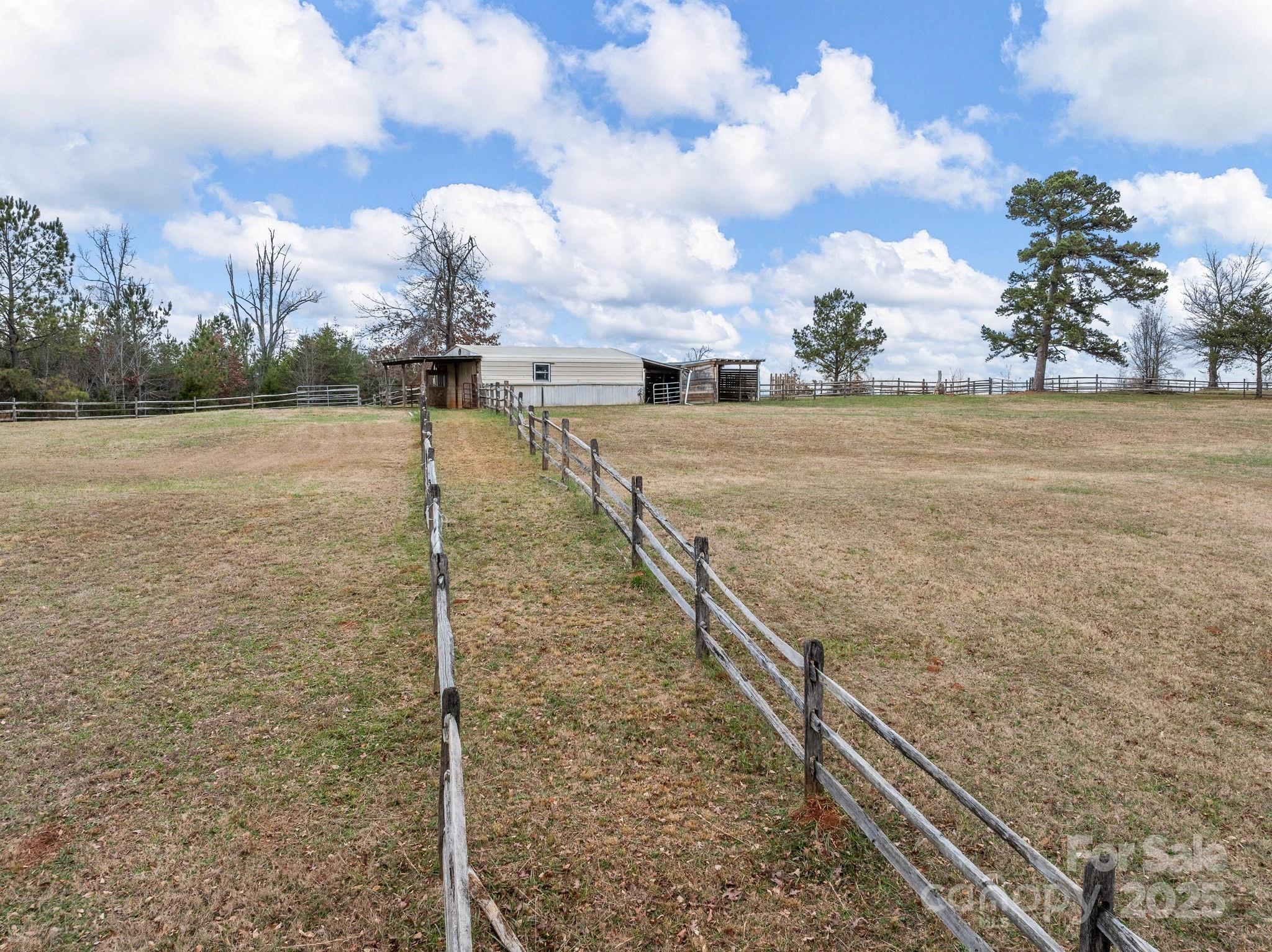 139 Clarkson Lane Tryon, NC 28782 - Photo 40 of 48 a view of a pathway both side of building with yard