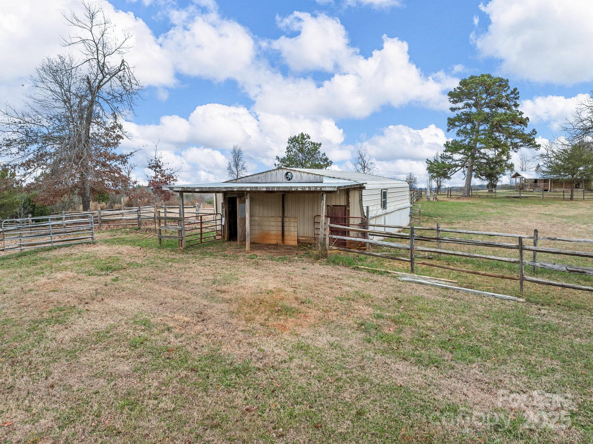 139 Clarkson Lane Tryon, NC 28782 - Photo 45 of 48 a view of a house with a yard
