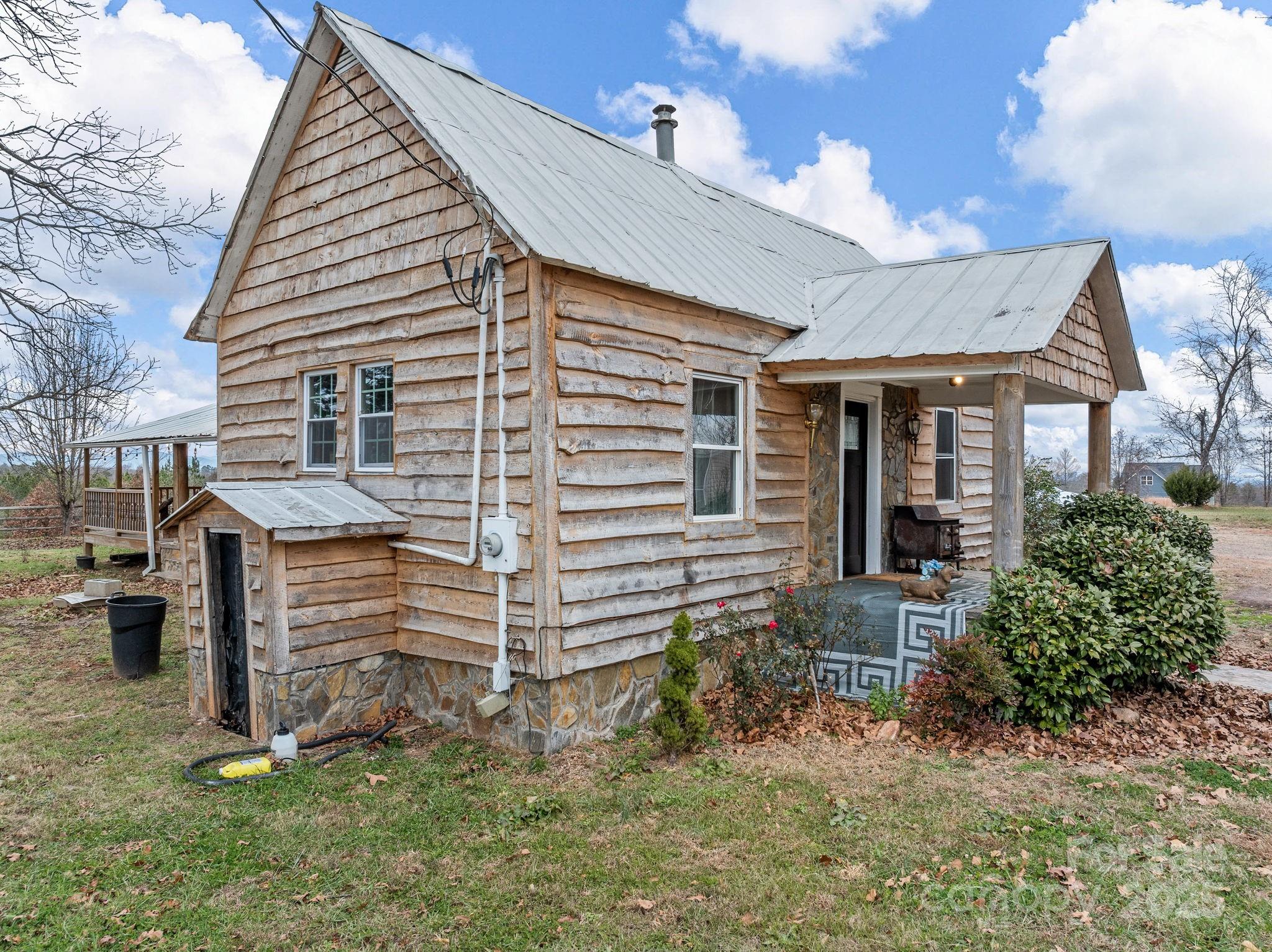 139 Clarkson Lane Tryon, NC 28782 - Photo 6 of 48 a front view of a house with a yard