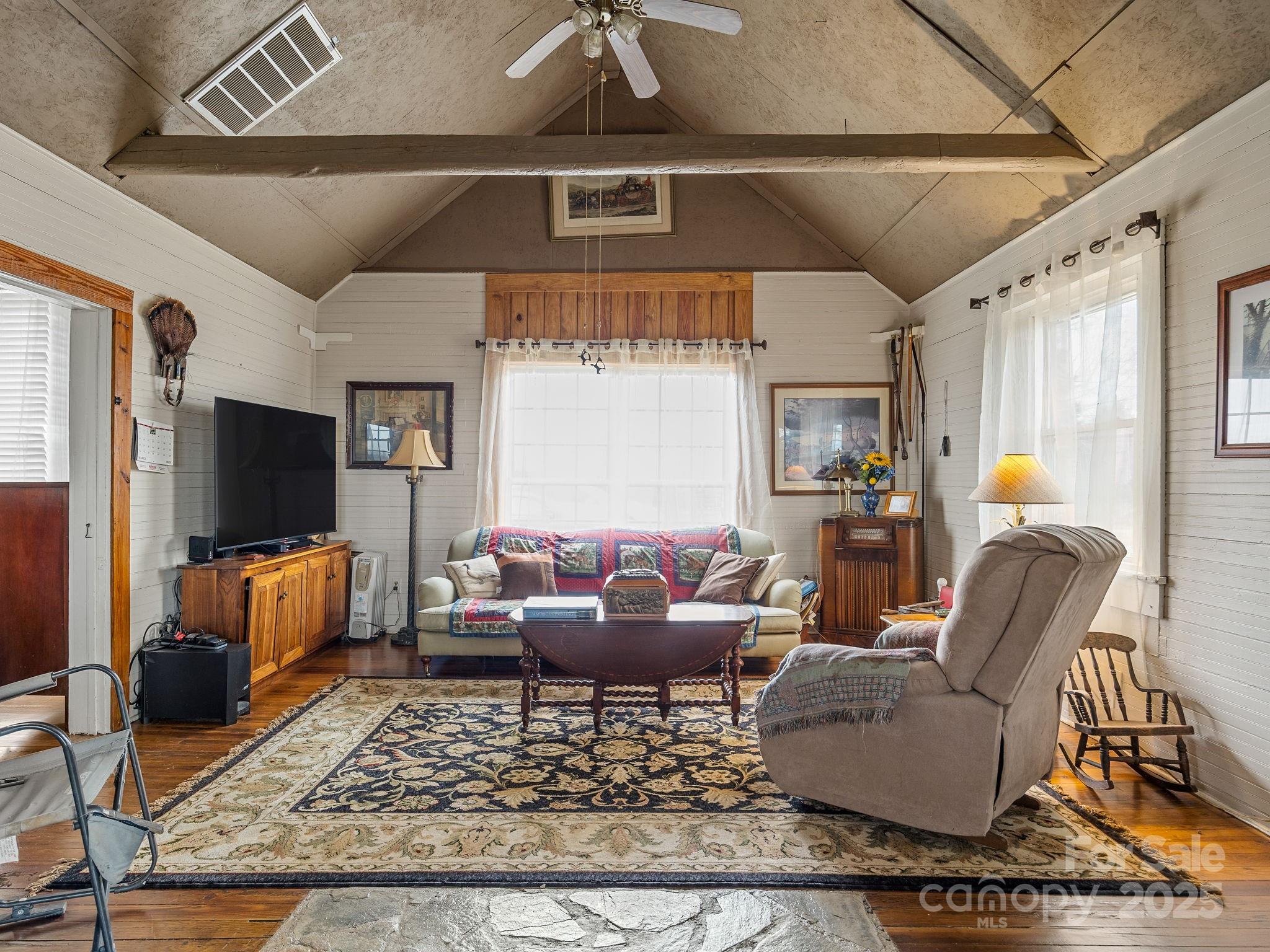 139 Clarkson Lane Tryon, NC 28782 - Photo 10 of 48 a living room with furniture a rug and a flat screen tv
