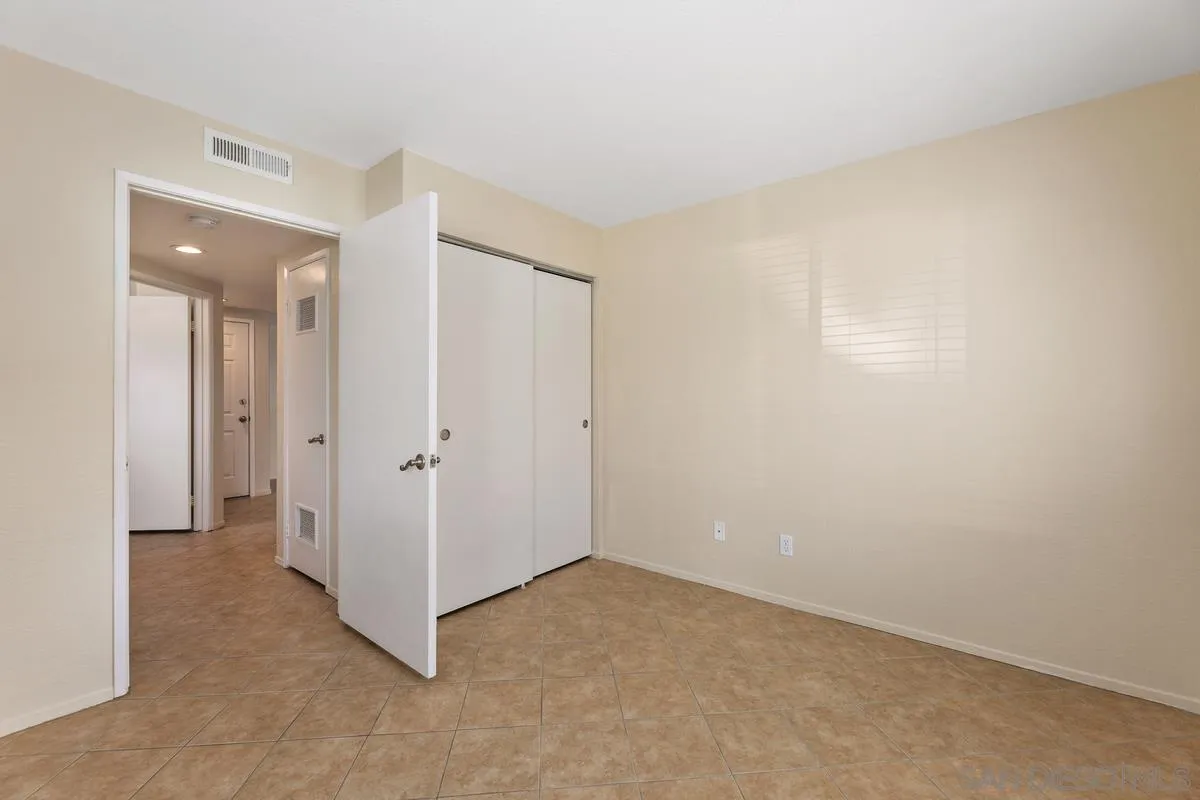 405 Stoney Point Way, Unit 89 Oceanside, CA 92058 - Photo 18 of 32 a view of an empty room