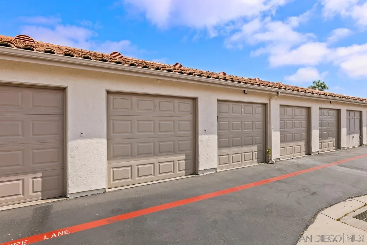 405 Stoney Point Way, Unit 89 Oceanside, CA 92058 - Photo 23 of 32 a front view of a house with a garage
