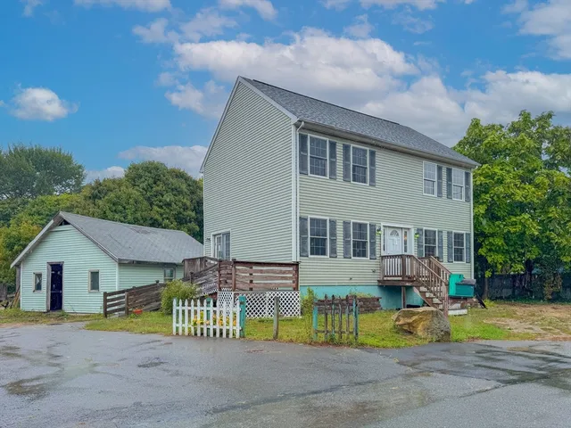 a view of house with outdoor seating area