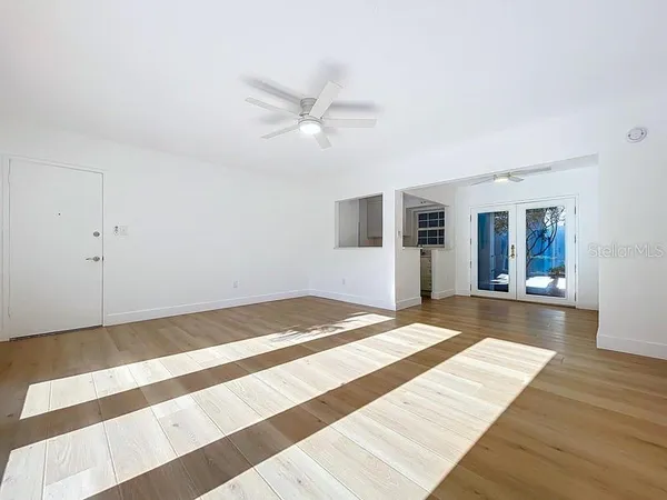 a view of an empty room with a window