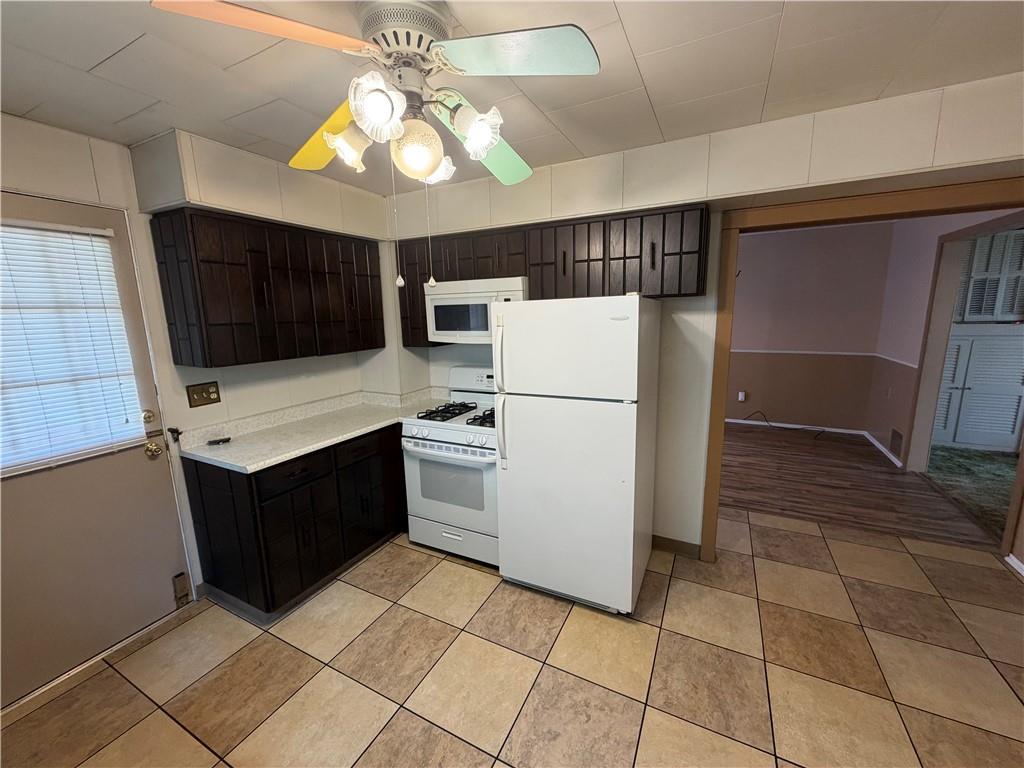 1041 4th Street Monongahela, PA 15063 - Photo 10 of 28 a kitchen with a refrigerator a stove top oven and cabinets