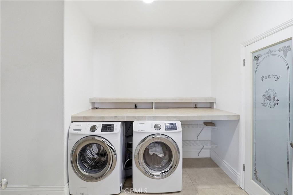 16025 Perry Heights Drive Riverside, CA 92504 - Photo 23 of 52 a utility room with dryer and washer