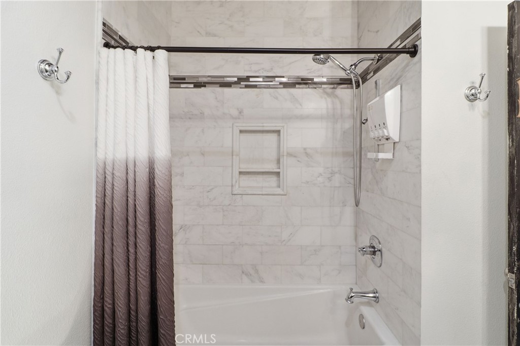 16025 Perry Heights Drive Riverside, CA 92504 - Photo 26 of 52 a bathroom with a shower