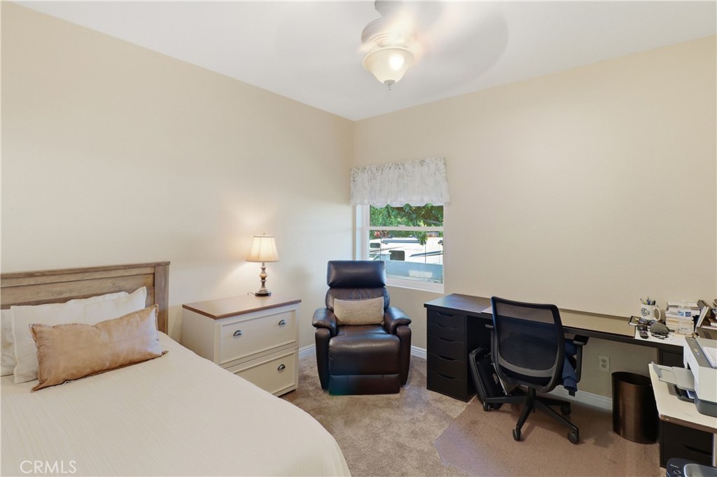 16025 Perry Heights Drive Riverside, CA 92504 - Photo 28 of 52 a bedroom with a bed and a desk