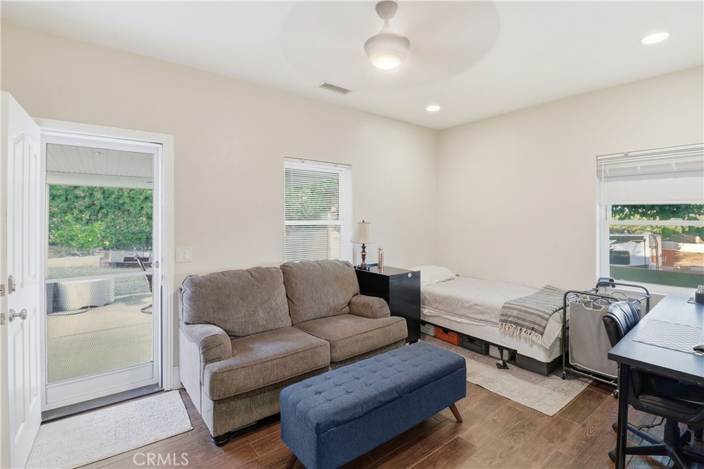 16025 Perry Heights Drive Riverside, CA 92504 - Photo 29 of 52 a living room with furniture and a window