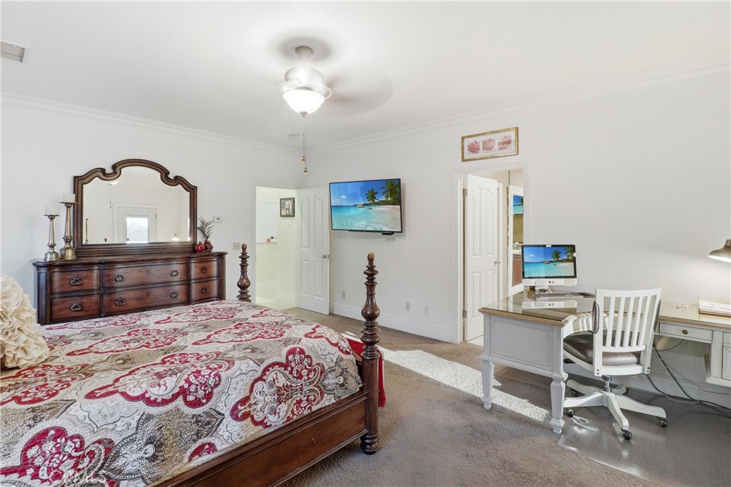 16025 Perry Heights Drive Riverside, CA 92504 - Photo 32 of 52 a bedroom with a bed and a chandelier
