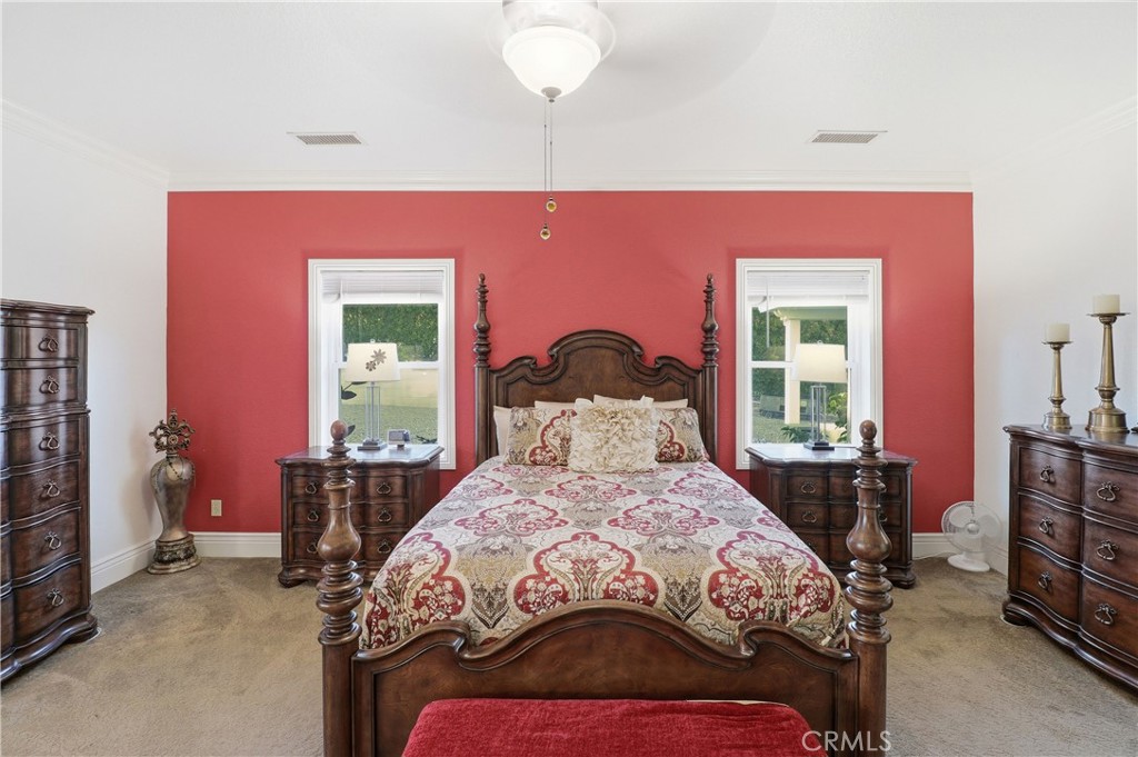 16025 Perry Heights Drive Riverside, CA 92504 - Photo 34 of 52 a bedroom with a bed and wooden floor