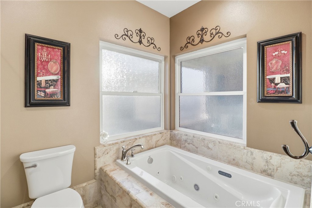 16025 Perry Heights Drive Riverside, CA 92504 - Photo 39 of 52 a bathroom with a tub sink and toilet