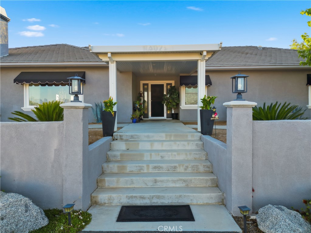 16025 Perry Heights Drive Riverside, CA 92504 - Photo 4 of 52 a view of a house with entrance gate