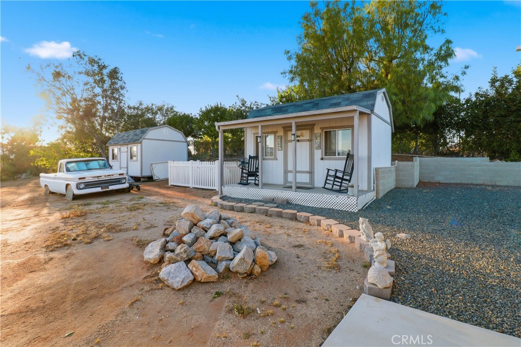 16025 Perry Heights Drive Riverside, CA 92504 - Photo 44 of 52 a front view of a house with a yard and garage
