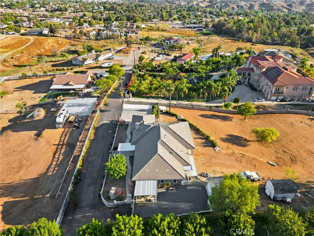 16025 Perry Heights Drive Riverside, CA 92504 - Photo 49 of 52 an aerial view of residential houses with outdoor space and swimming pool