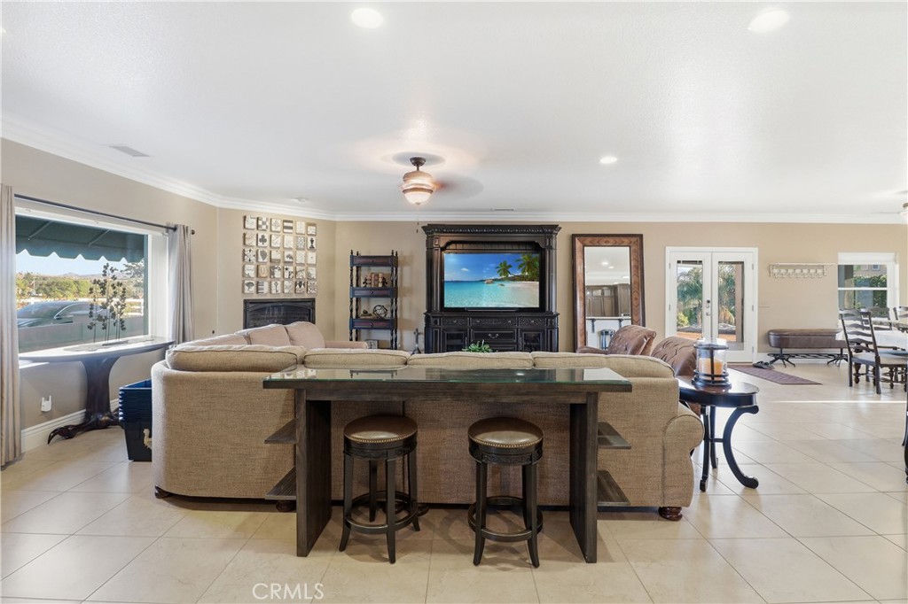 16025 Perry Heights Drive Riverside, CA 92504 - Photo 9 of 52 a living room with furniture and a large window