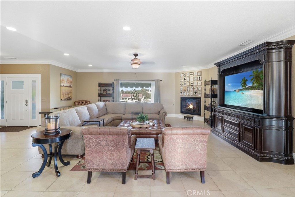 16025 Perry Heights Drive Riverside, CA 92504 - Photo 10 of 52 a living room with furniture and a flat screen tv