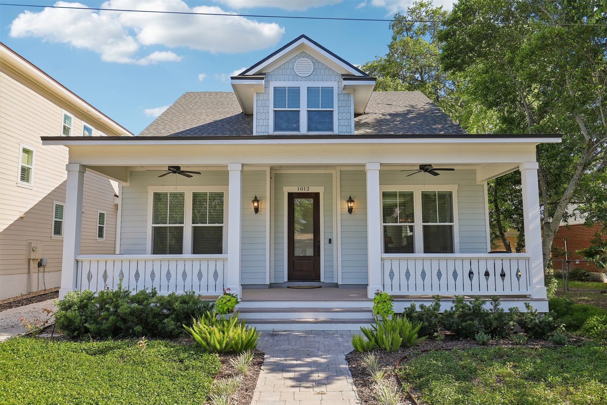 1012 White Street Fernandina Beach, FL 32034 - Photo 1 of 35 a view of a brick house with plants and large tree