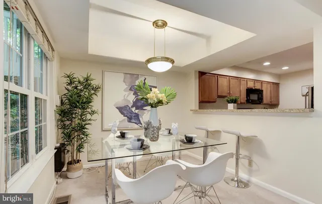 a kitchen with a table and chairs in it