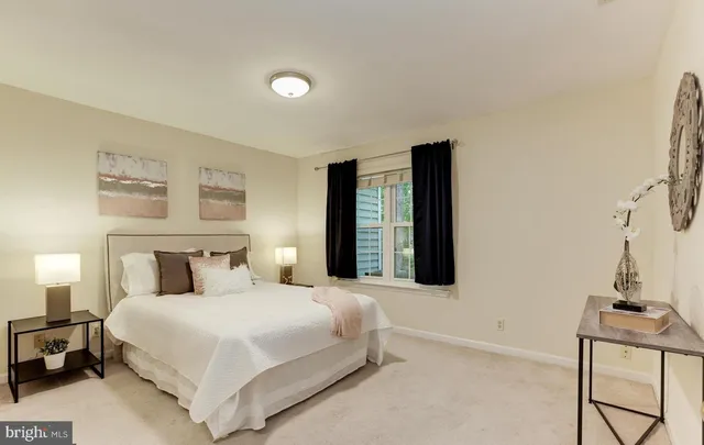 a bedroom with a bed and a table