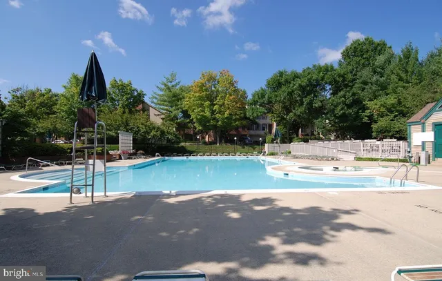 a view of a swimming pool with a yard