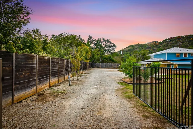 a view of a wrought iron fences in front of house