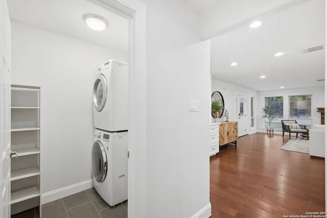 a view of a hallway with washer and dryer