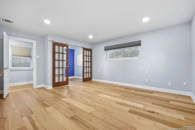 a view of an empty room with a window