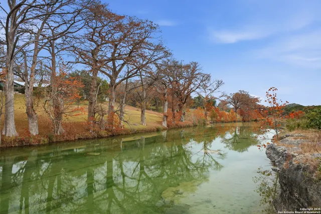 a view of lake with green space