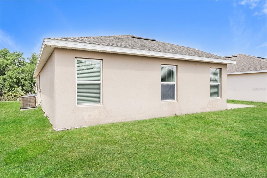 1473 Lucerne Loop Road Northeast Winter Haven, FL 33881 - Photo 25 of 25 a front view of house with yard