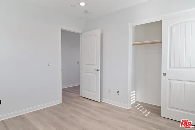 an empty room with wooden floor