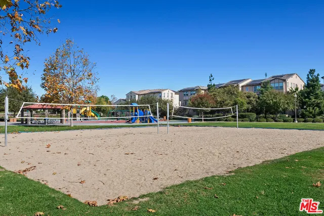 a view of an house with backyard space and balcony