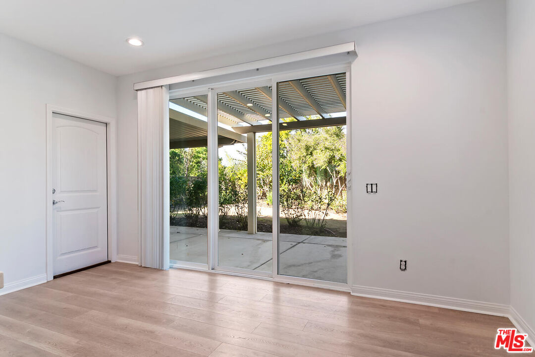291 Santa Susana Road Camarillo, CA 93010 - Photo 10 of 32 a view of an empty room with wooden floor and a window