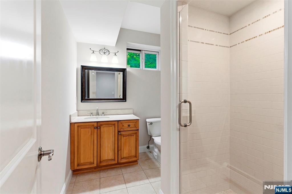 767 Orangeburgh Road River Vale, NJ 07675 - Photo 41 of 49 a bathroom with a sink vanity mirror and shower