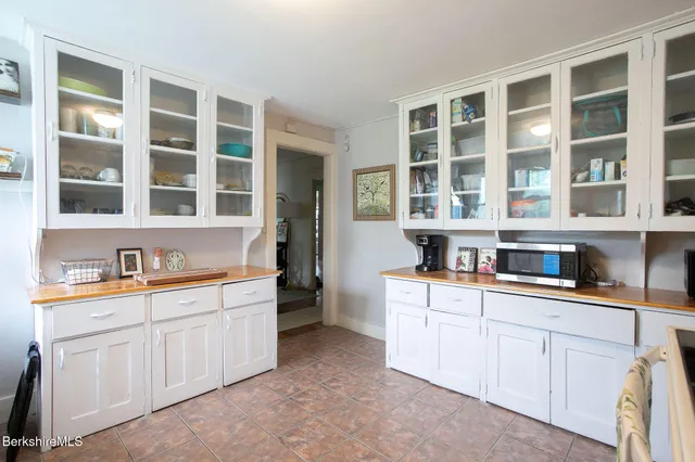 a bedroom with a bed and flat screen tv
