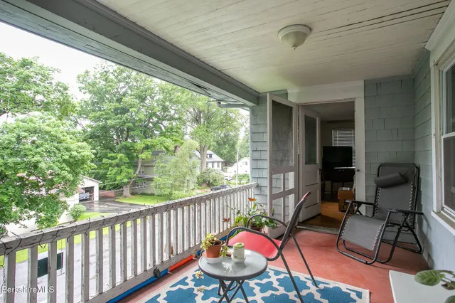a kitchen with cabinets and window