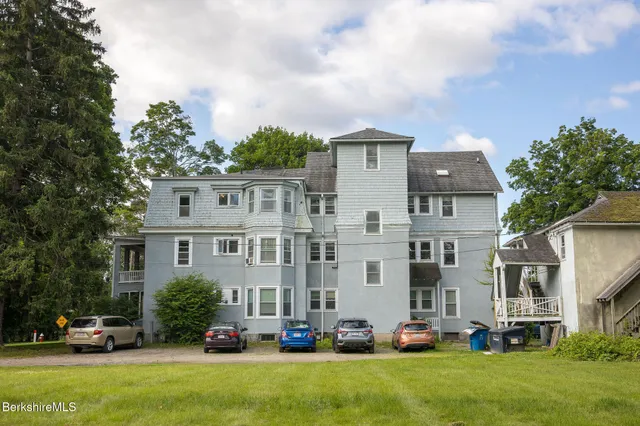a cars parked in front of a house