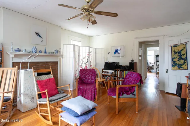 a living room with furniture windows and a fireplace